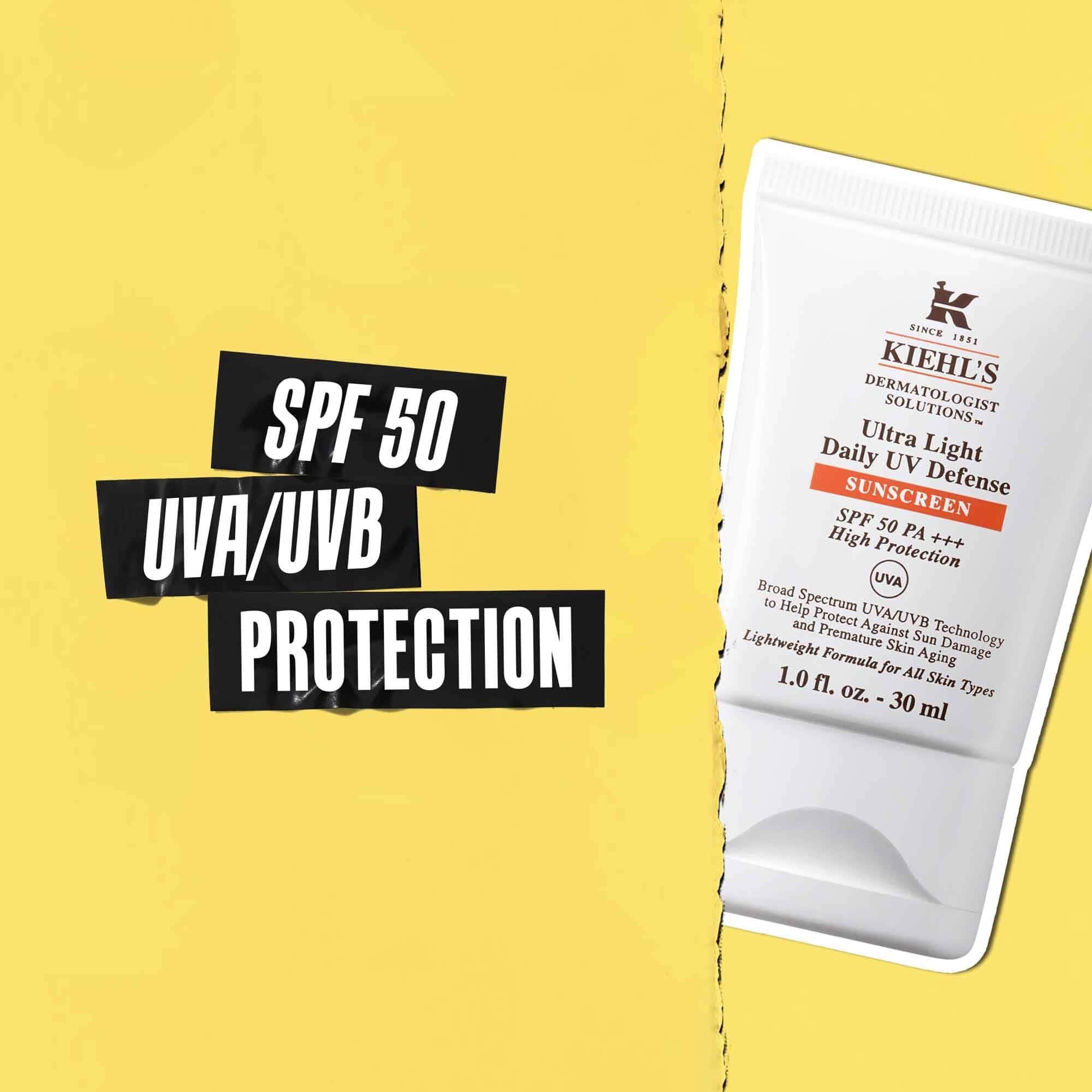 Napis SPF 50 UVA/UVB ochrana na černe pasce s obrazkem tuby Ultra-Light Daily UV Defense vedle ni.
