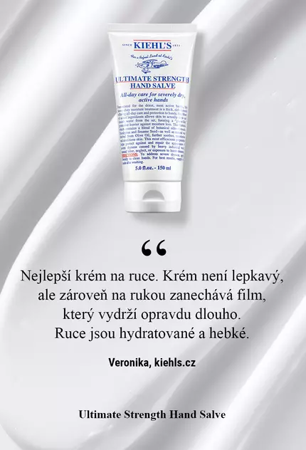 Туба с крем за ръце "Ultimate Strength Hand Salve" на Kiehl's, поставена на бяла вълнообразна повърхност. Текстът обяснява характеристиките на продукта.