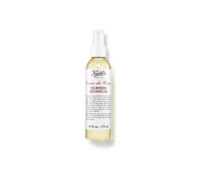 Olejnaty sprej Kiehl's Creme de Corps, vyživny suchy tělovy olej v průhledne lahvičce.