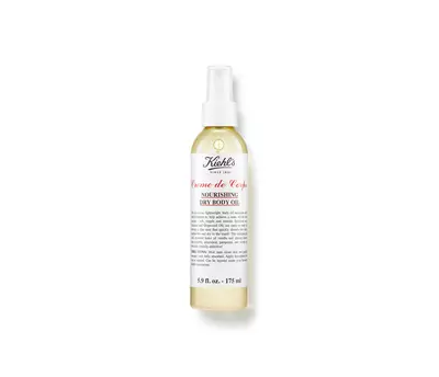 Olejnaty sprej Kiehl's Creme de Corps, vyživny suchy tělovy olej v průhledne lahvičce.
