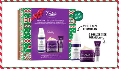 A festive Kiehl's gift set featuring a purple box with a bow, containing two full-size anti-aging products and two deluxe-size formulas, presented against a holiday-themed background. The box emphasizes a $140 value.