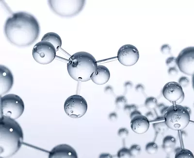 A close-up view of translucent molecules, featuring spherical shapes connected by thin lines, against a light background, symbolizing scientific concepts related to chemistry or molecular biology.